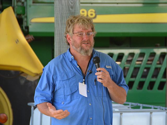 Zeb Winslow III, a farmer near Scotland Neck, N.C., talks about his cover crop mix and changes to his operation during the Conservation Technology Information Center (CTIC) tour last week. Winslow has reduced his fertilizer and chemical inputs on his farm but cautions farmers against trying to make quick, wholesale changes because of high fertilizer prices. (DTN photo by Chris Clayton)