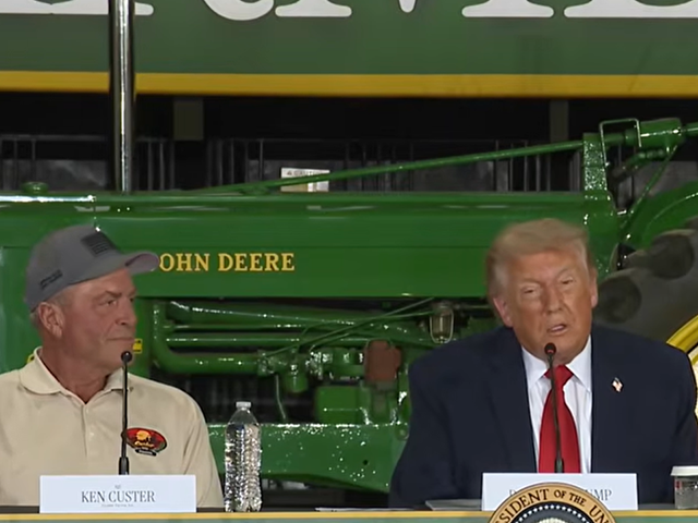 Ken Custer, whose farm President Donald Trump was visiting Friday in Chippewa Falls, Wisconsin, listens to Trump talk about the farm economy. Trump suggested there will potentially be more government aid to farmers coming from his administration. (Screenshot image from livestream)